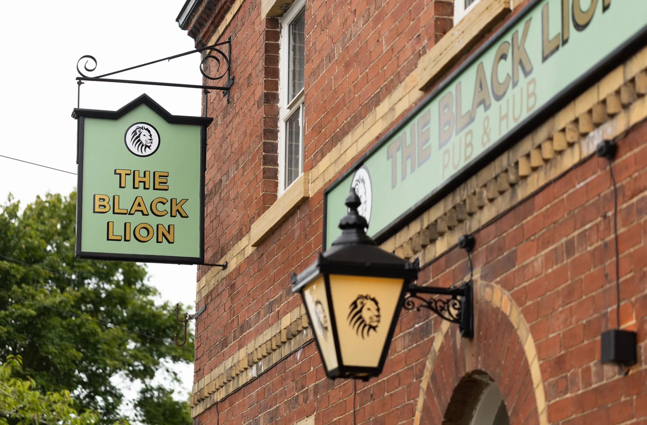 The Black Lion hanging sign and exterior lantern