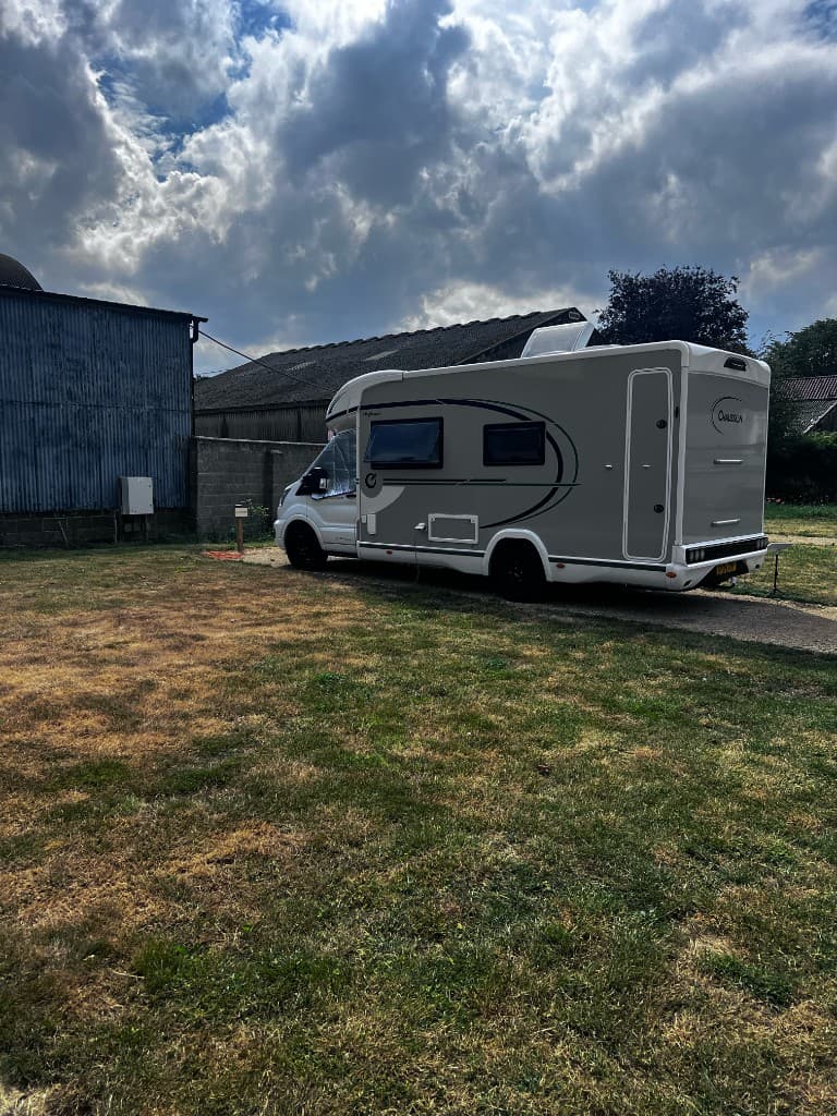 Whin Covert pitch with a touring motorhome in place